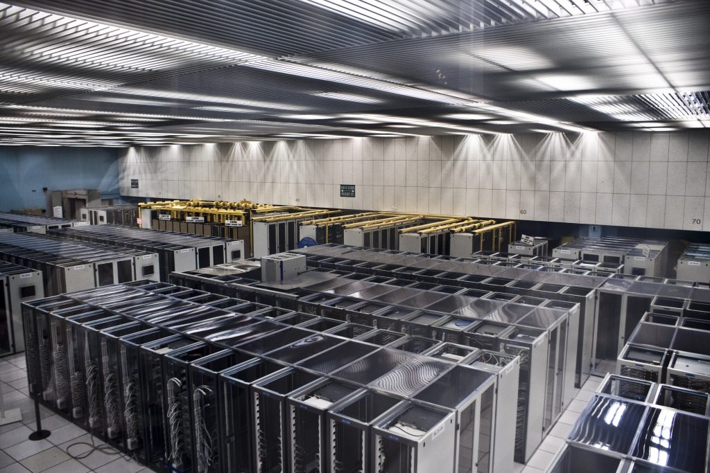 A large data hall filled with rows of server racks