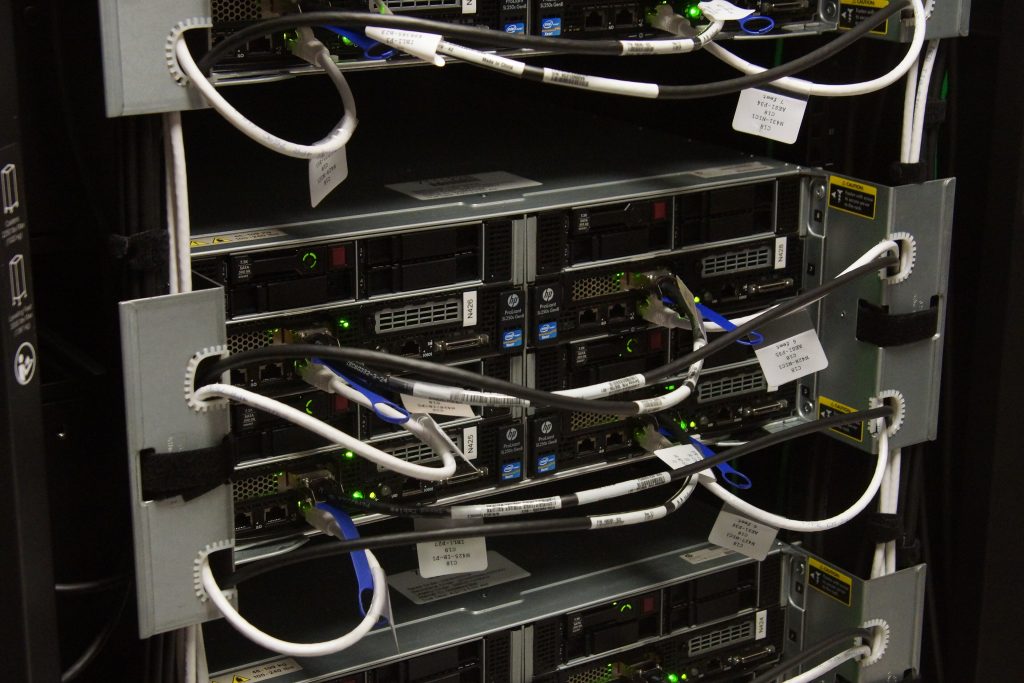 Rack servers with their network cables labelled and tied back