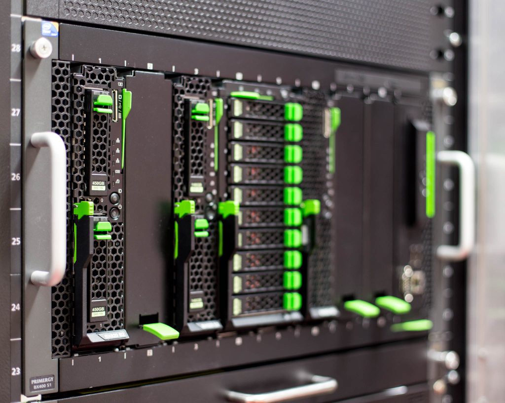 A server chassis whose green handles mark its hot-plug parts