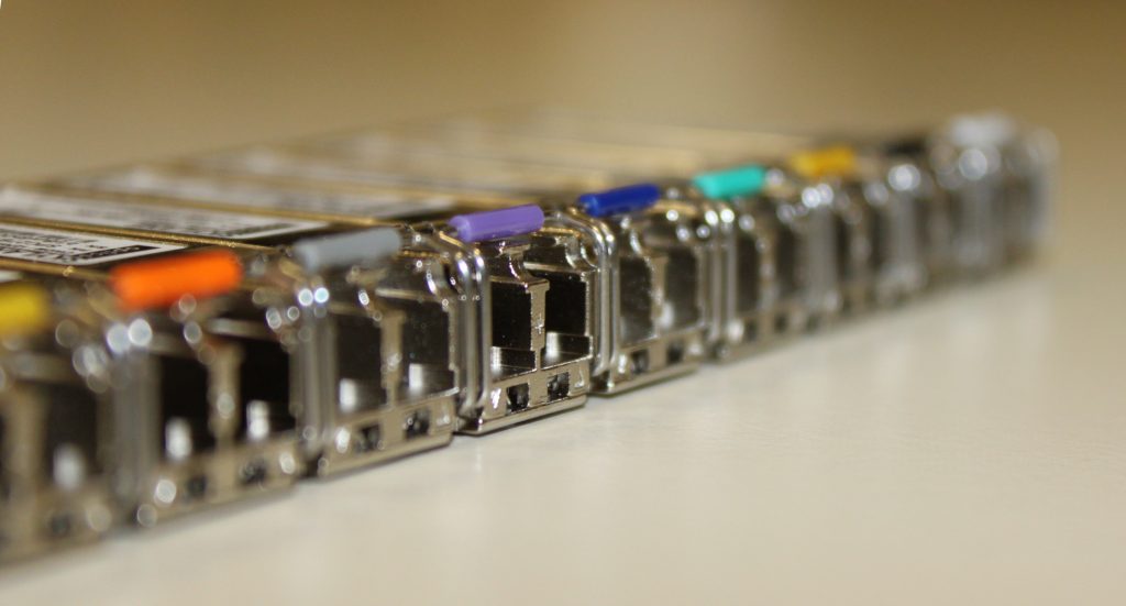 A row of optical transceivers in a switch