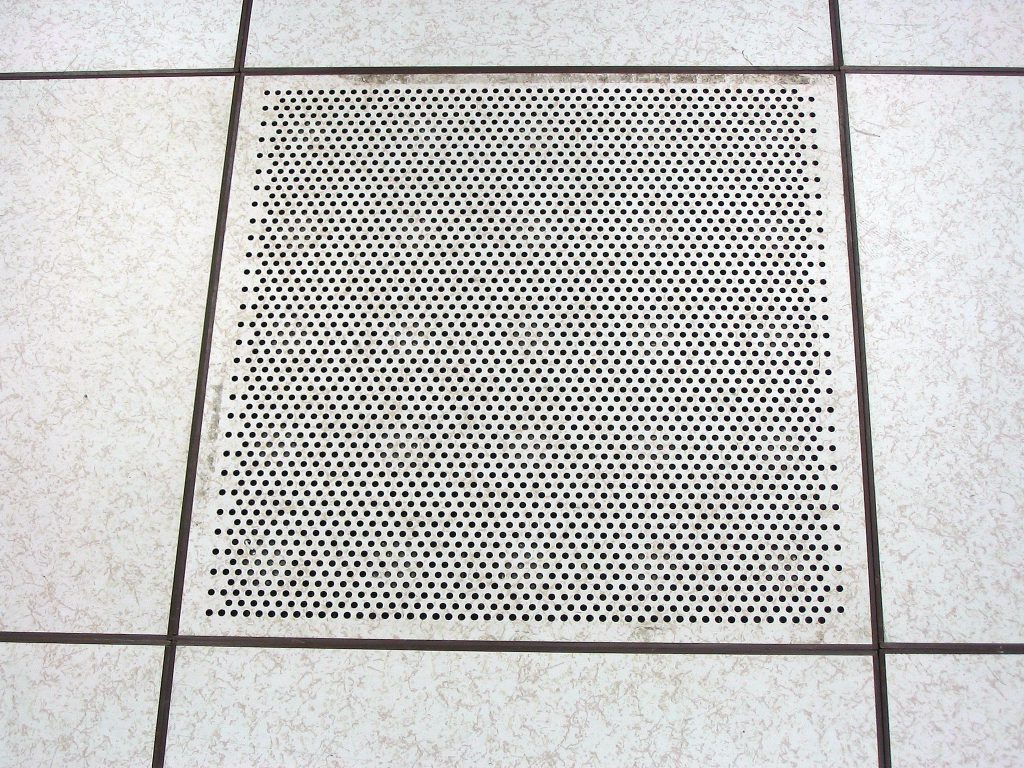 Perforated cooling tile in a raised data centre floor