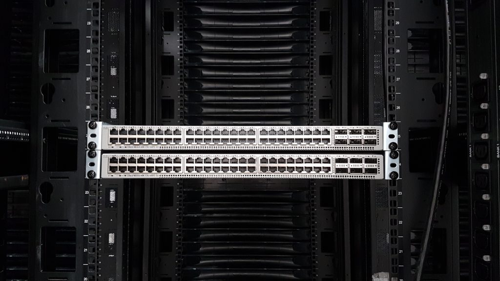 A nearly empty 42U rack with one patch panel