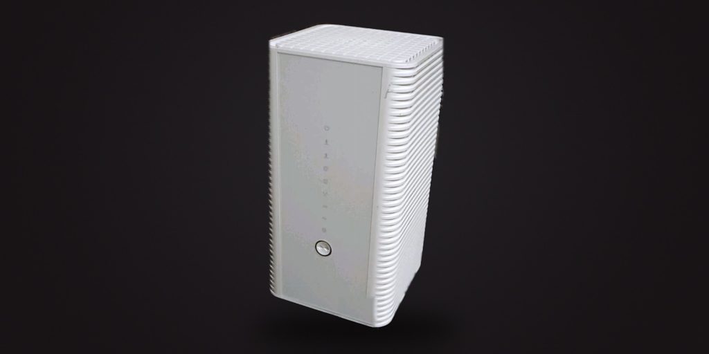 The white Hitron CODA-4582 modem, seen from the front at a slight angle, on a dark ground
