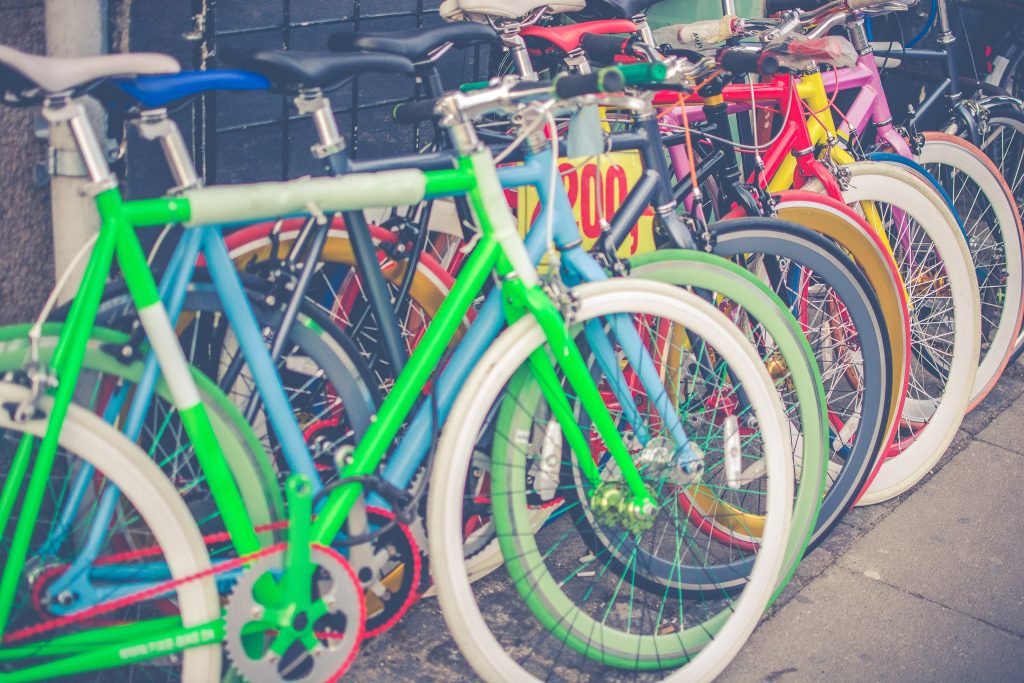 Rows of colourful bicycles in a bike shop