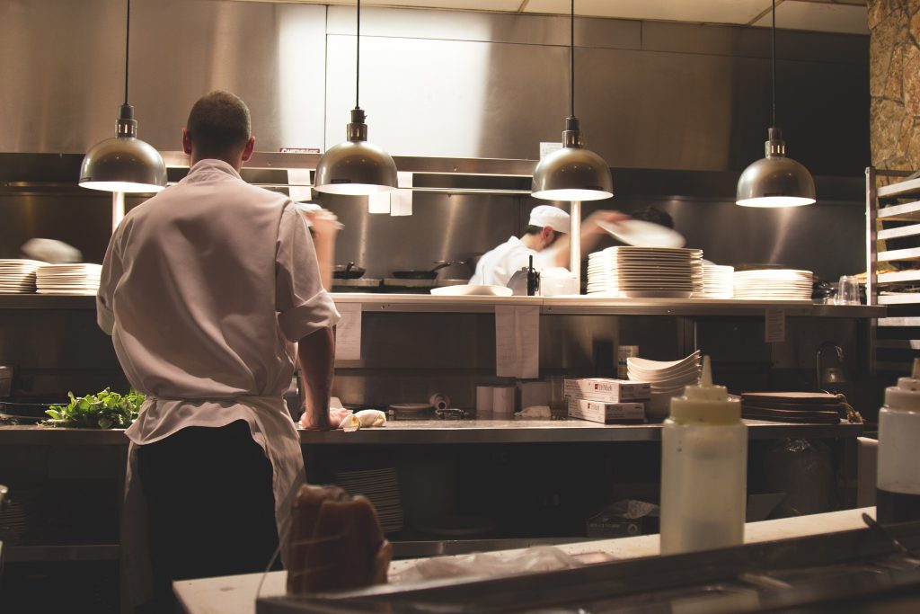 Chefs at work in a restaurant kitchen