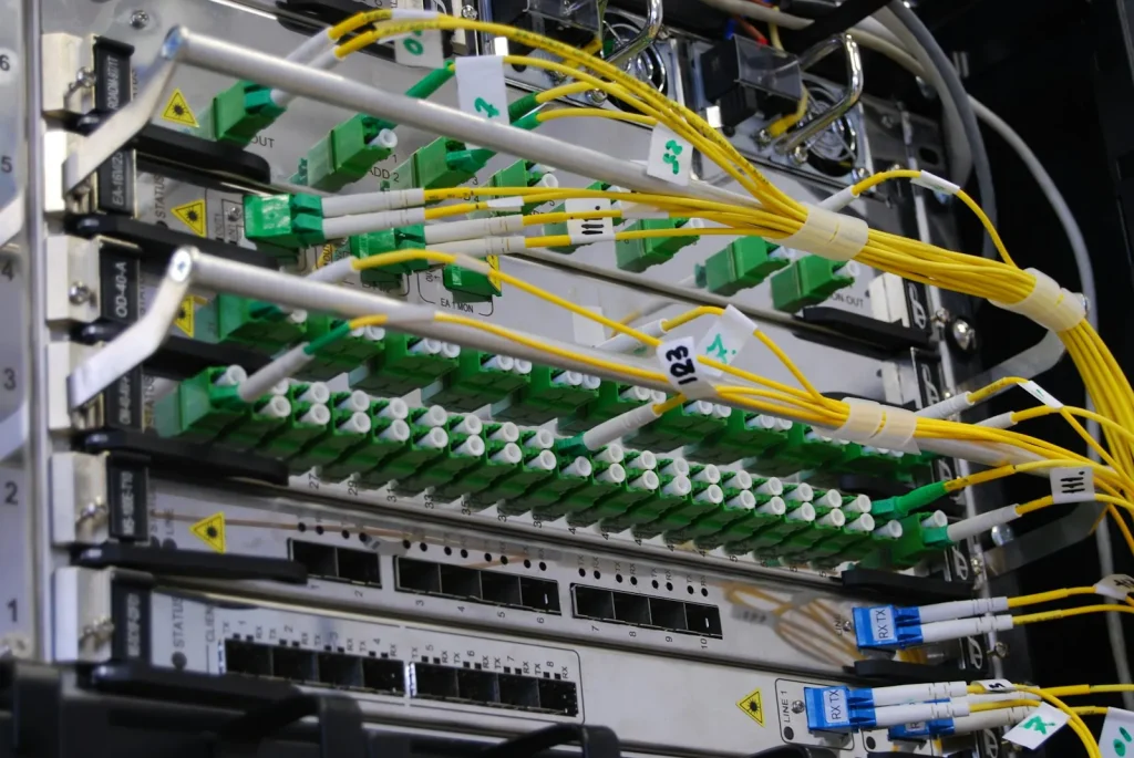 Fibre optic patch cables connected to a fibre panel in a server rack