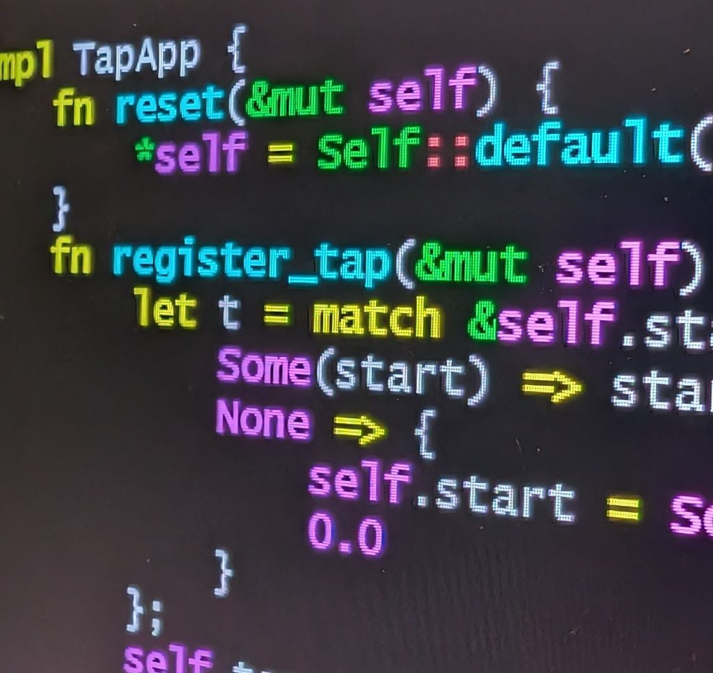 Close view of programming code on a screen, keywords in colour